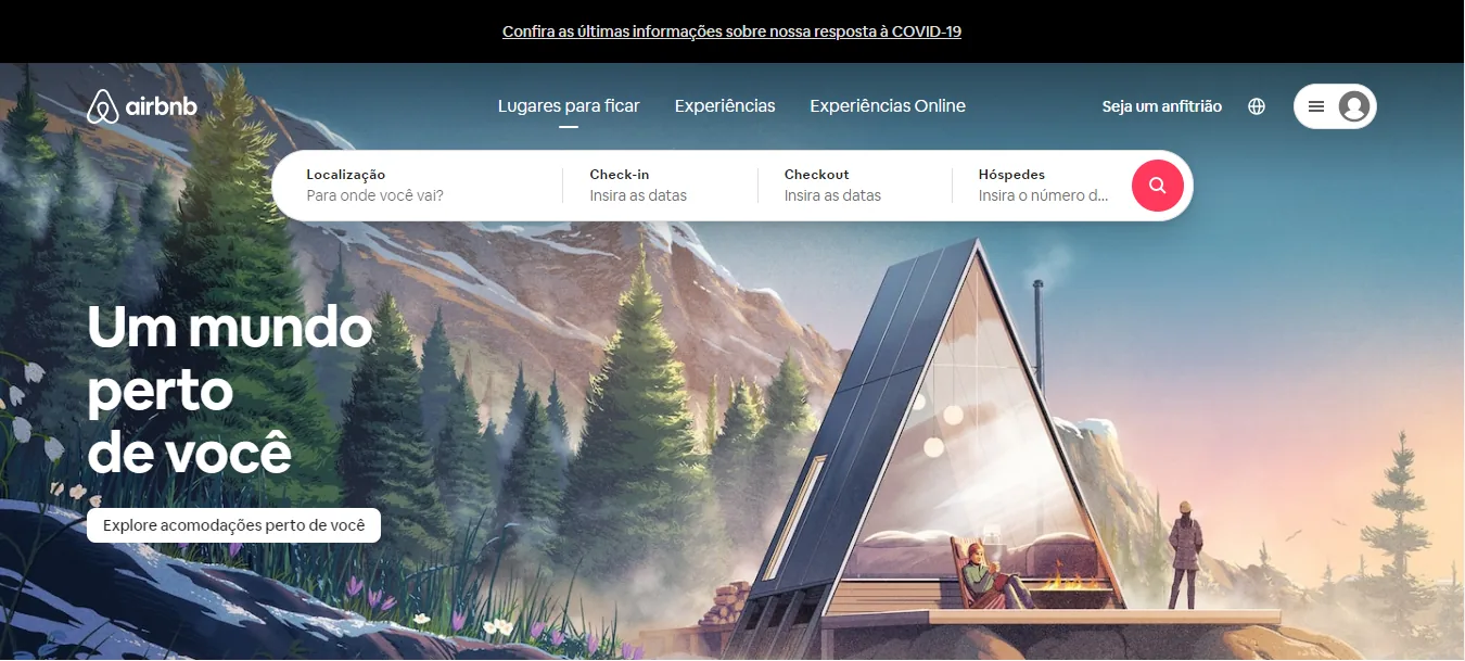 Página inicial do Airbnb em 2021: no topo, a busca por localização, datas e hóspedes; abaixo, o título Um mundo perto de você e o botão Explore acomodações perto de você